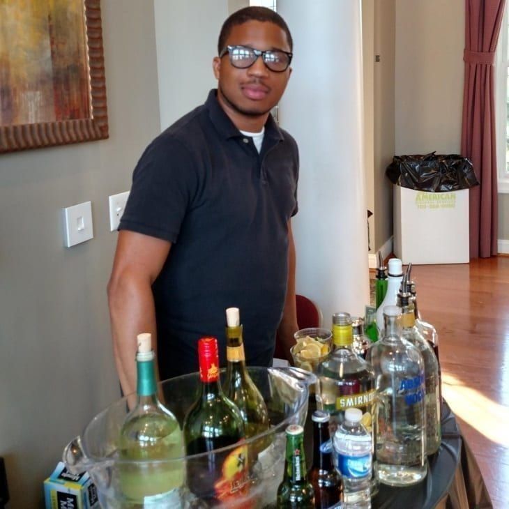 PBS graduate bartending an event