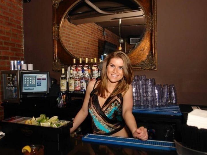 PBS graduate bartending at a hotel bar